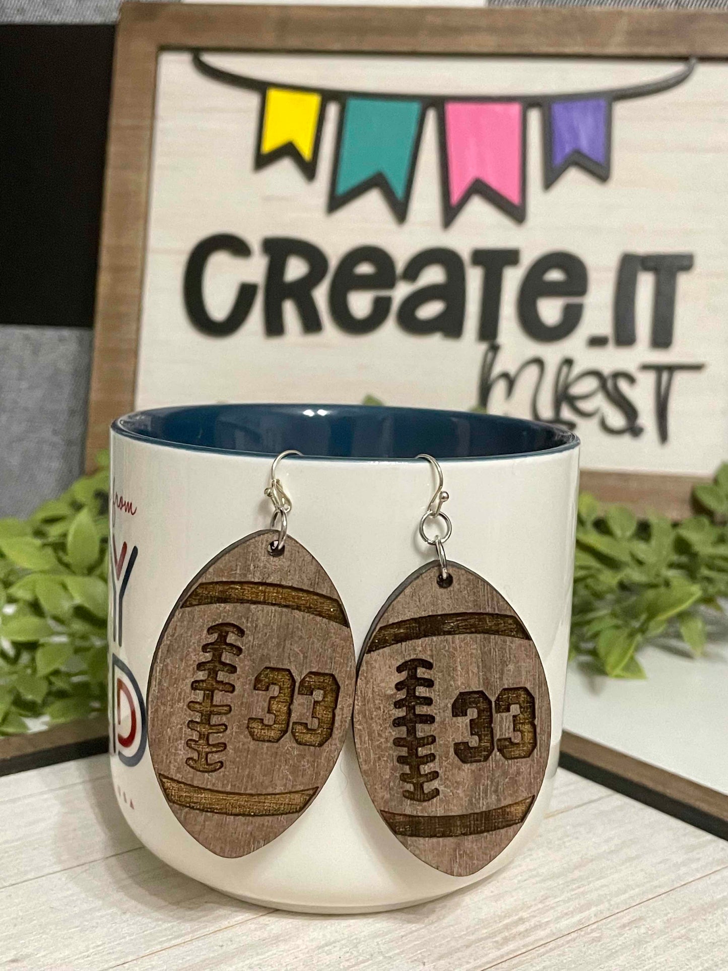 football shape earring with engraved number