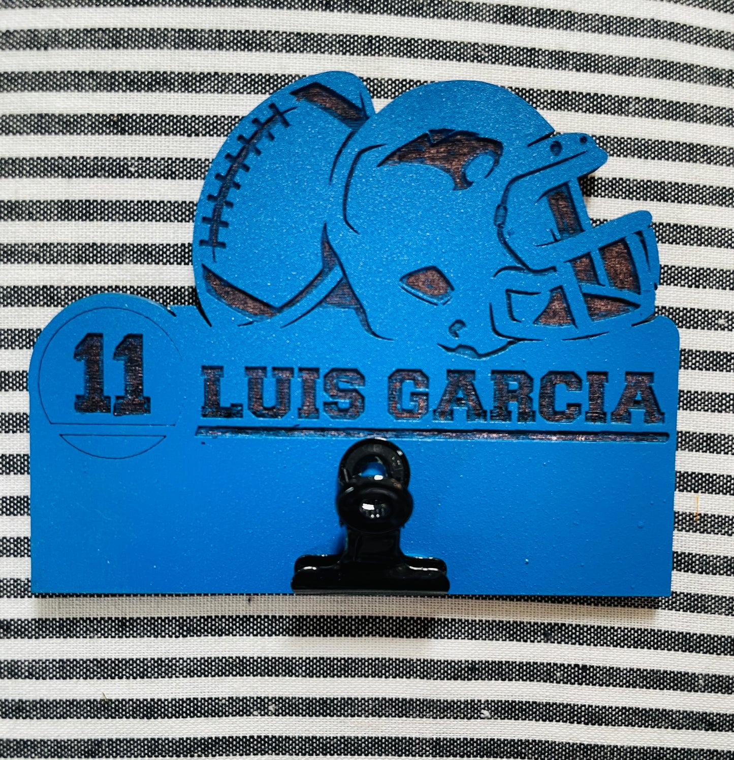 Football sign with metal clip